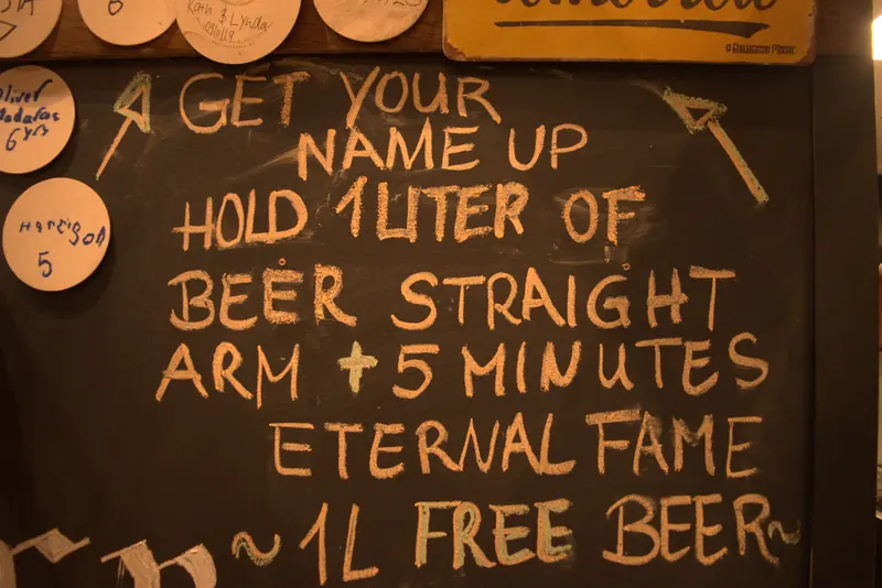 Chalkboard challenge: hold 1 litre of beer straight-armed for 5 minutes for eternal fame and a free litre