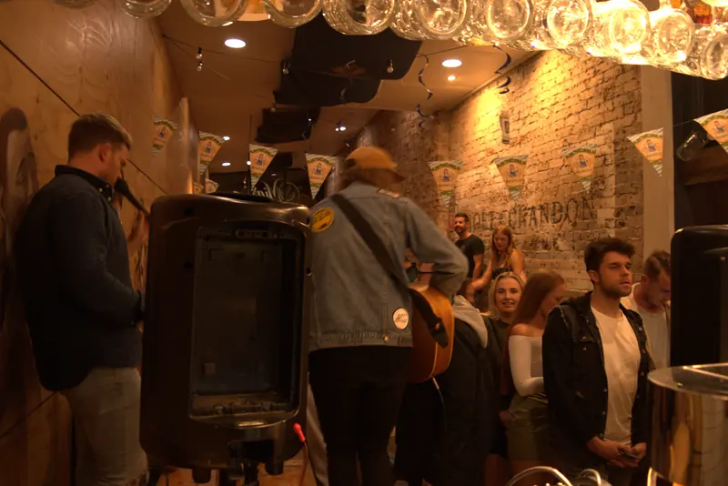 Patrons gathered inside the brick-walled beerhall on a busy night